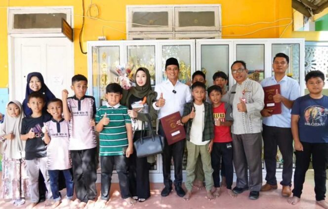 
 Dari Kantor ke Sekolah: Bupati Irwan Sabri Dukung Gerakan Ayah Ambil Rapor